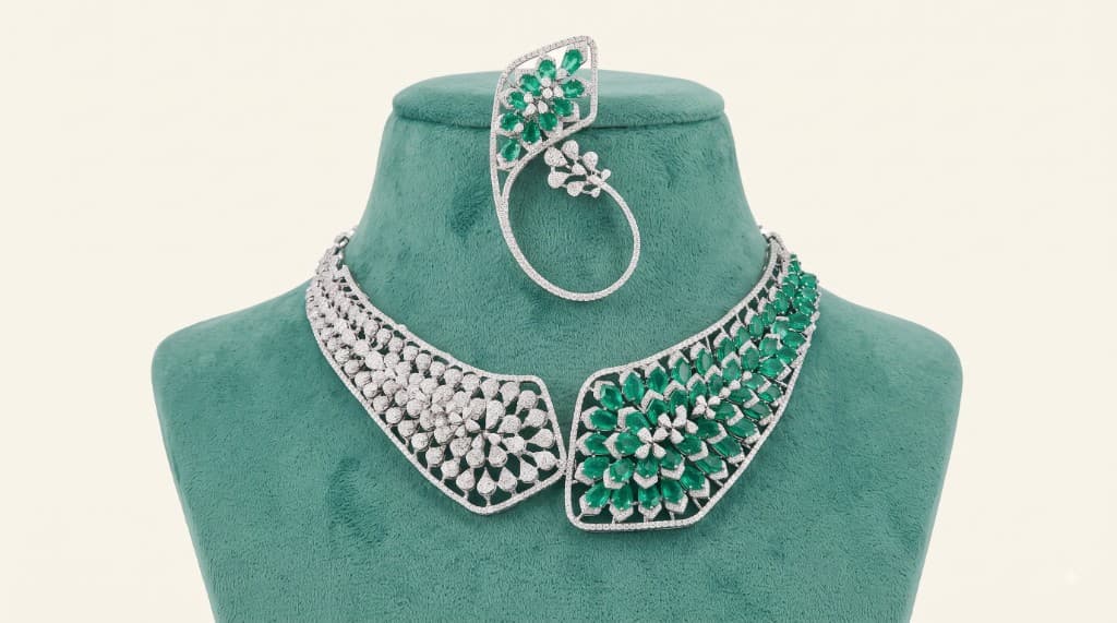 Chawla Jewellers Aanya emerald collar necklace — asymmetric open-front design with pavé diamonds, marquise emeralds and floral ear cuff