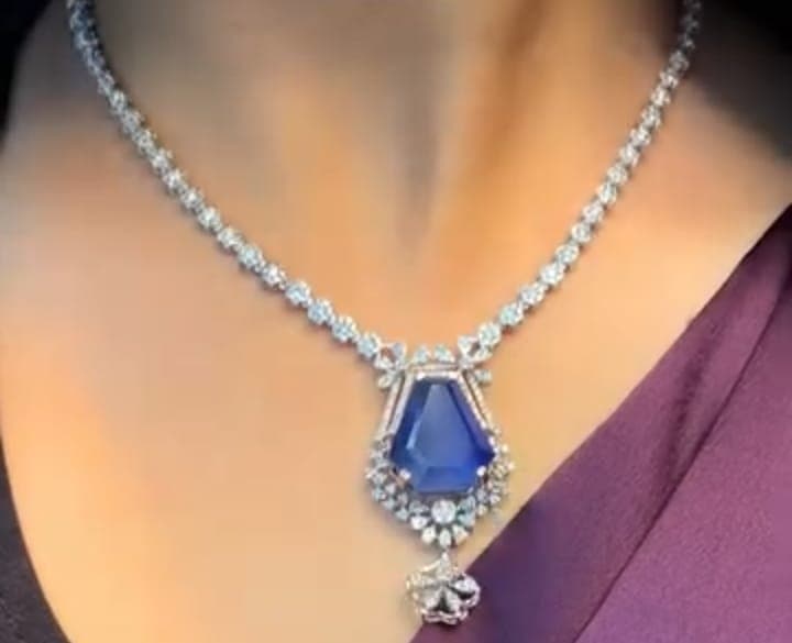 Chawla Jewellers Kiara kite sapphire necklace — diamond tennis line with geometric kite-cut sapphire and floral diamond drop