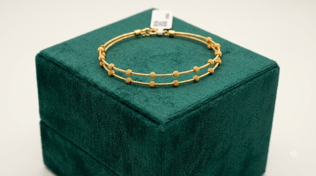 Chawla Jewellers Maaya beaded gold bangle — double-strand 22kt hallmarked gold with granulated bead accents on velvet