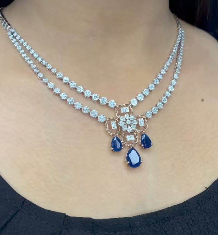 Chawla Jewellers Sara dual sapphire necklace — double diamond strands with rose-gold floral pendant and three pear sapphires