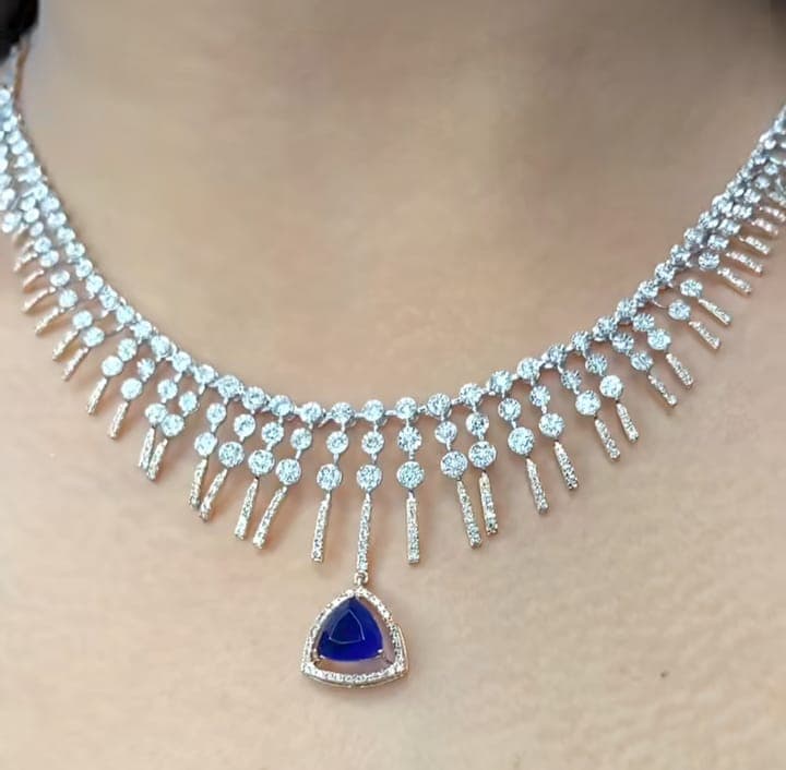 Chawla Jewellers Zara fringe sapphire necklace — graduated diamond drops with trillion-cut blue sapphire halo centre