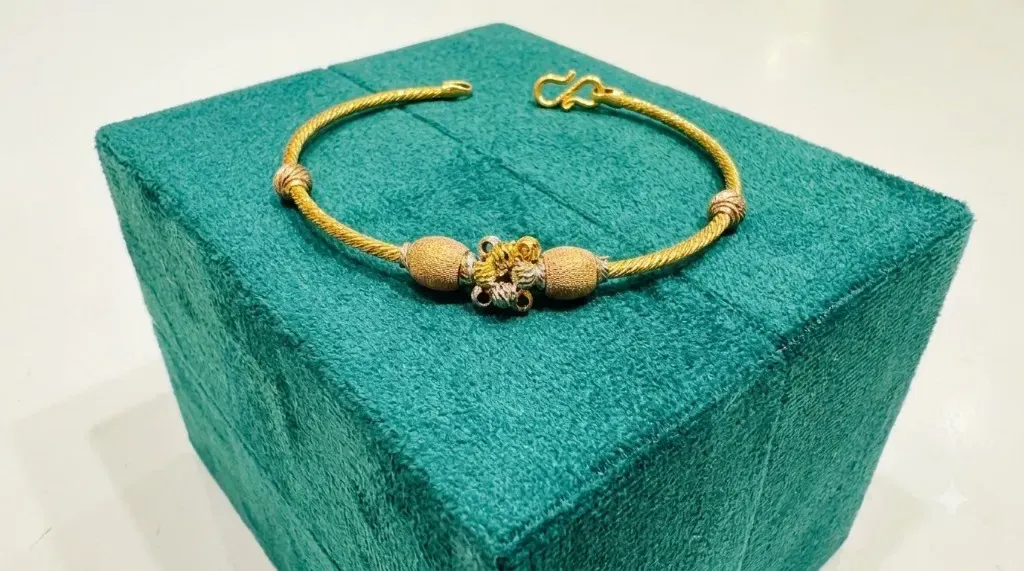 The Trisha Twisted Gold Kada — Tri-color gold rope kada with textured bead clusters by Chawla Jewellers